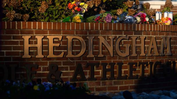 PHOTO: Flowers lay at the entrance of the Hedingham neighborhood, Oct. 14, 2022, in Raleigh, N.C., after a shooting left five dead. (Melissa Sue Gerrits/Getty Images)