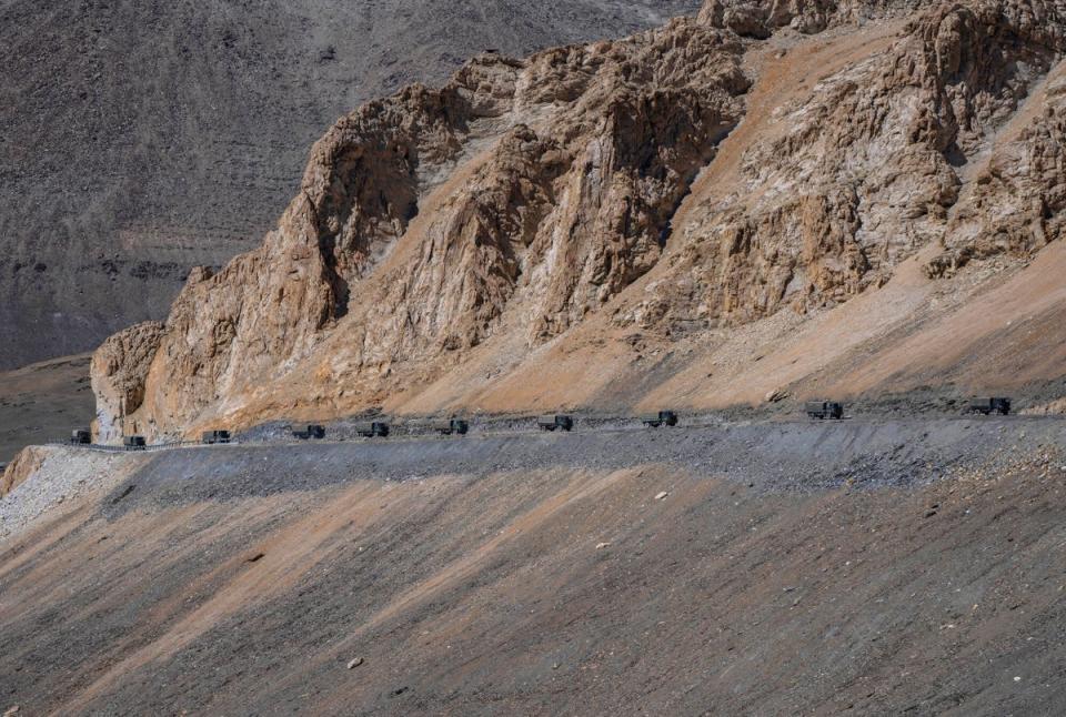 Indian army vehicles move in a convoy in the cold desert region of Ladakh, where India and China are locked in a military standoff, (Copyright 2022 The Associated Press. All rights reserved)