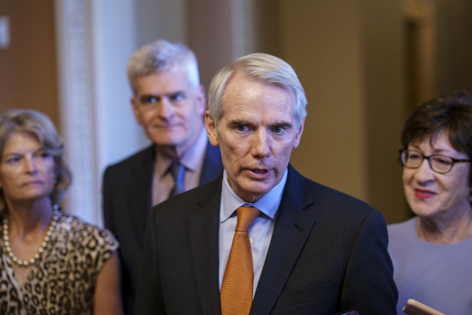 Sen. Rob Portman, R-Ohio, the lead GOP negotiator in the infrastructure talks, is joined by, from left, Sen. Lisa Murkowski, R-Alaska, Sen. Bill Cassidy, R-La., and Sen. Susan Collins, R-Maine, as he announces an agreement with Democrats on a $1 trillion infrastructure bill, saying they are ready to vote to take up the bill, at the Capitol in Washington, Wednesday, July 28, 2021. (AP Photo/J. Scott Applewhite)