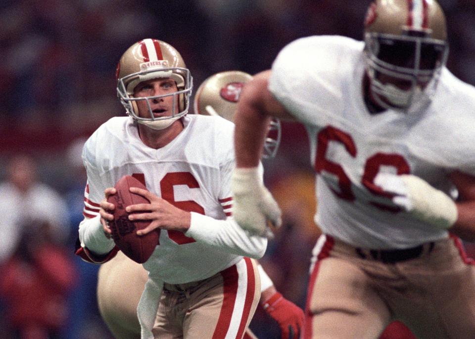 Jan 28, 1990; New Orleans, LA, USA; FILE PHOTO; San Francisco 49ers quarterback Joe Montana (16) looks to throw against the Denver Broncos during Super Bowl XXIV at the Superdome. The 49ers defeated the Broncos 55-10. Mandatory Credit: USA TODAY Sports