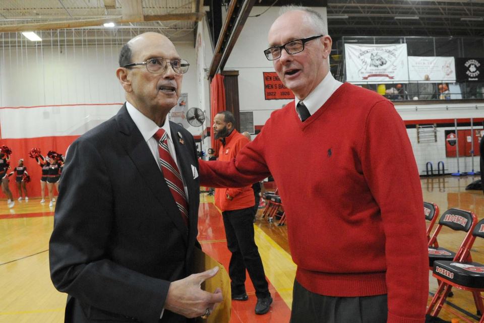 Victor Ortiz, left, and Bob Boen, right, pose for a photo on Friday, Jan. 24, 2020 when the school renamed the court in honor of Ortiz.