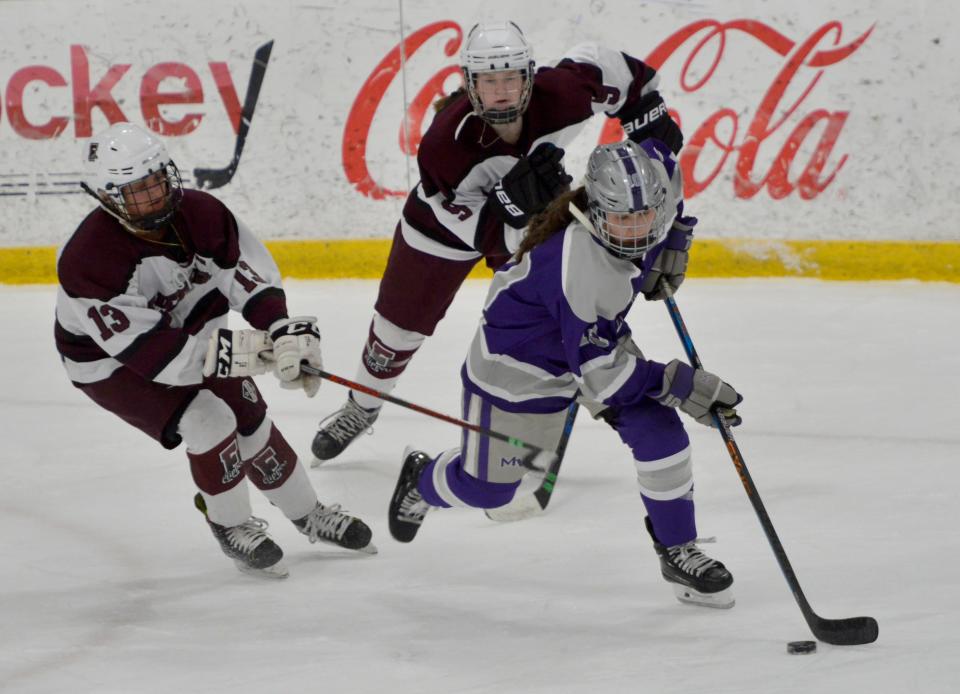 Martha's Vineyard's Maia Donnelly skates down the ice with the puck in first quarter action.