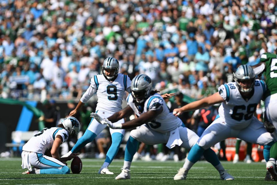 Carolina Panthers kicker Ryan Santoso (9) kicks a field goal in the fourth quarter at Bank of America Stadium.