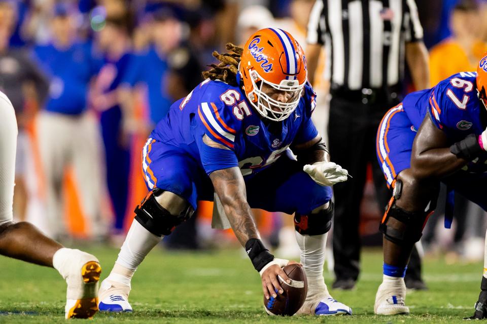 Sep 16, 2023; Gainesville, Florida, USA; Florida Gators offensive lineman Kingsley Eguakun (65) waits to snap the ball during the second half against the Tennessee Volunteers at Ben Hill Griffin Stadium. Mandatory Credit: Matt Pendleton-USA TODAY Sports