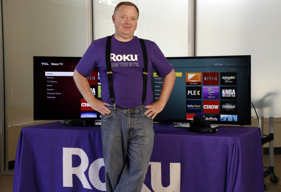FILE - In this May 19, 2014, file photo, Roku CEO Anthony Wood poses for a portrait, in Saratoga, Calif. Shares of Roku, an early player in streaming-video gadgets, are soaring Thursday, Sept. 28, 2017, after an initial public offering raised $219 million. It is best known for its boxes and sticks that let users watch Netflix, Hulu and the growing universe of streaming-video options on their TVs. Roku has deep-pocketed competitors in Amazon, Google and Apple. (AP Photo/Marcio Jose Sanchez, File)