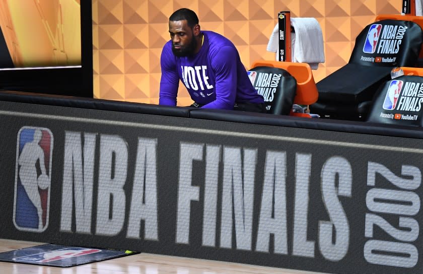 ORLANDO, FLORIDA OCTOBER 9, 2020-Lakers LeBron James sits alone before Game 5 of the NBA Finals