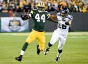 Green Bay Packers running back James Starks (44) gets past Seattle Seahawks defensive back Cary Williams (26) for extra yards in the third quarter at Lambeau Field. Sep 20, 2015; Green Bay, WI, USA. Benny Sieu-USA TODAY Sports