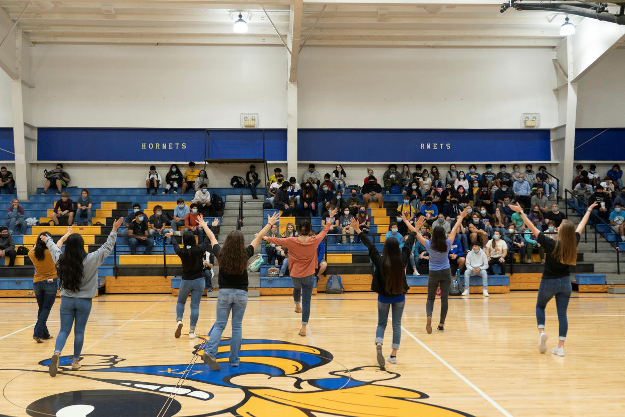 Cheerleaders at Louise High School perform as other students watch during a pep rally, as the COVID-19 pandemic continues in Louise, Texas, on Nov. 20. (Reuters/Go Nakamura)