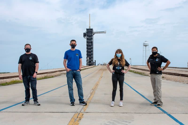 Jared Isaacman, Hayley Arceneaux, Sian Proctor and Chris Sembroski pose for a photo at NASA's Kennedy Space Center at Cape Canaveral