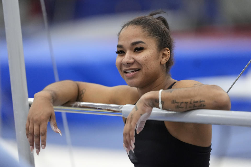 Gymnast Jordan Chiles pauses during training Thursday, Feb. 29, 2024, in Spring, Texas. Chiles doesn't have to put herself through this. She knows this. The proof is tattooed on her arm. It's sitting in her trophy room. It's on her social media pages, which are dotted with the kind of partnerships she once never dreamed possible.(AP Photo/David J. Phillip)