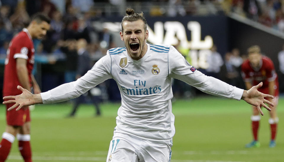 FILE - In this Saturday, May 26, 2018 file photo Real Madrid's Gareth Bale celebrates after scoring his side's second goal during the Champions League Final soccer match between Real Madrid and Liverpool at the Olimpiyskiy Stadium in Kiev, Ukraine. (AP Photo/Sergei Grits, File)