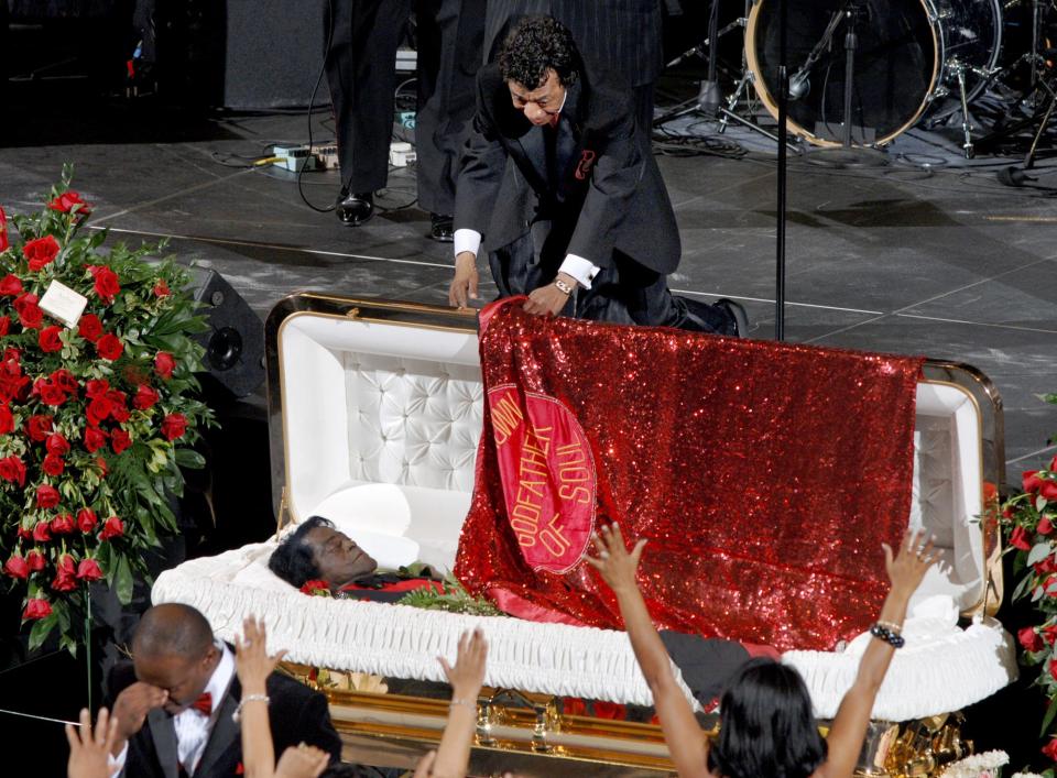 Danny Ray puts the cape on James Brown one last time December 30, 2006 at James Brown Arena during Brown's funeral. Ray died Tuesday.