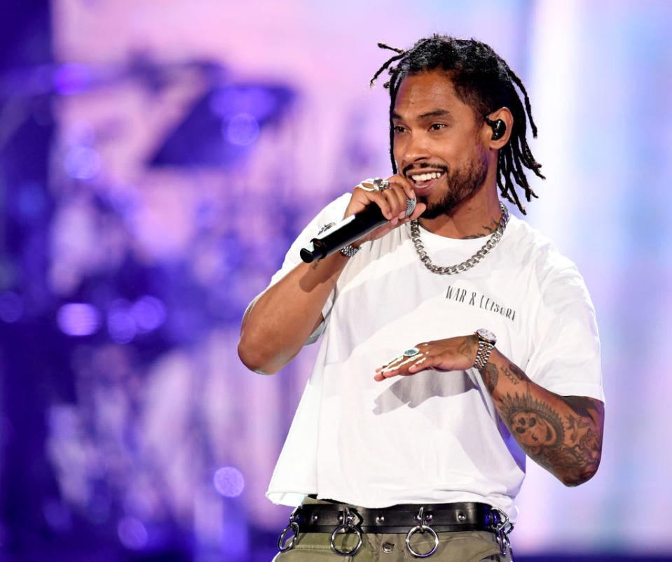 Close-up of Miguel onstage with a microphone