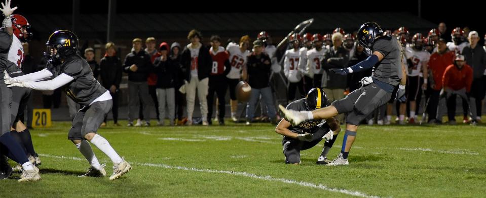 Airport's Nolan Zajac kicks a field goal against Dearborn Divine Child in the Division 4 District finals. He booted 6 field goals and 54 PATs this season.