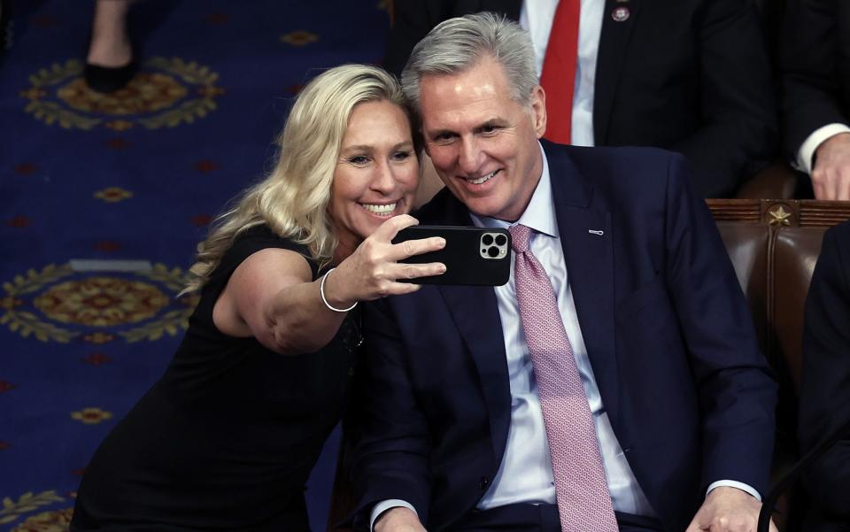 Marjorie Taylor Greene takes a photo with US House Republican Speaker Kevin McCarthy - Getty Images