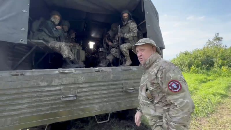 Founder of Wagner private mercenary group Yevgeny Prigozhin speaks with servicemen during withdrawal of his forces from Bakhmut