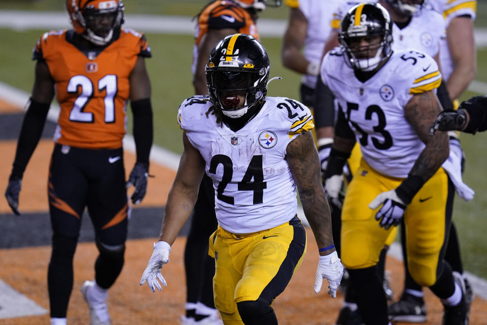 Pittsburgh Steelers' Benny Snell (24) reacts after rushing for a touchdown during the second half of an NFL football game against the Cincinnati Bengals, Monday, Dec. 21, 2020, in Cincinnati. (AP Photo/Michael Conroy)