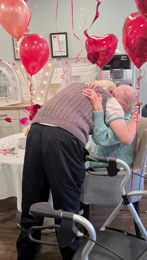 This is the moving moment a devoted wife surprised her dementia-stricken husband by moving into his care home after a month apart - because she 'can't live without him'. Pensioner Kenneth Meredith, 96, walked through the door with his zimmer-frame and broke down in tears when he saw wife Betty Meredith, 91, sitting down in front of him. Seconds later he rushes over to his wife of 71-years, who is seen sitting at a table for a make-shift date night, decorated with heart shaped balloons and roses. With The Platters' 1954 hit 'Only You', playing in the background, the couple share a long hug, after spending five weeks apart. The pair were heartbroken after Kenneth moved into Bourn View Care Home, Birmingham, five weeks ago due to his worsening battle with Alzheimer's. Due to strict rules, he couldn't see wife Betty, who he has been with for 76 years. And with no sign the pandemic was lifting, lonely Betty asked if she could be moved into the care home because she could no longer be apart from her husband. Unbeknown to Kenneth, Betty had moved into the floor below as she waited for her Covid-19 test results - but would continue to phone him for their daily chats. Once her results came back negative, Betty and staff helped arrange the surprise for Kenneth on November 10.