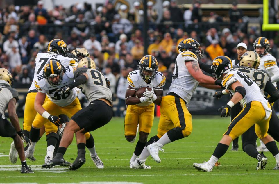 Iowa Hawkeyes running back Kaleb Johnson	(2) breaks through the Purdue Boilermakers defensive line during the NCAA football game against the Purdue Boilermakers, Saturday, Nov. 5, 2022, at Ross-Ade Stadium in West Lafayette, Ind.