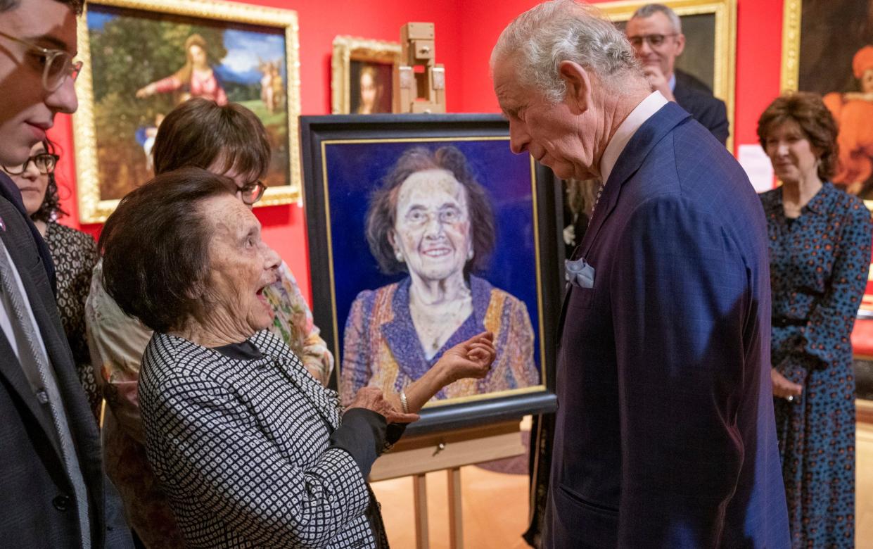 The Prince of Wales chats to Holocaust survivor Lily Ebert, who showed him her number tattoo, at the unveiling of her portrait at a poigrnant exhibition at The Queen’s Gallery, Buckingham Palace