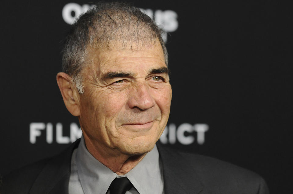 FILE - In this Monday, March 18, 2013 file photo, Robert Forster arrives at the LA premiere of "Olympus Has Fallen" at the ArcLight Theatre in Los Angeles. Forster, the handsome character actor who got a career resurgence and Oscar-nomination for playing bail bondsman Max Cherry in "Jackie Brown," has died at age 78. Forster's agent Julia Buchwald says he died Friday, Oct. 11, 2019, at home in Los Angeles of brain cancer. (Photo by Jordan Strauss/Invision/AP, File)