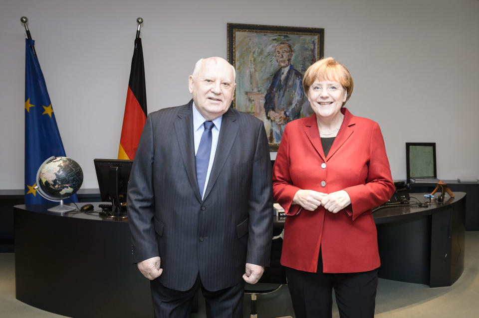 Gorbachev with German Chancellor Angela Merkel in 2014. - Credit: Getty Images