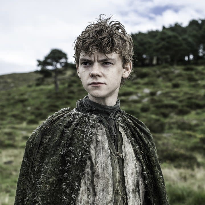 Thomas Brodie-Sangster in a mossy cape