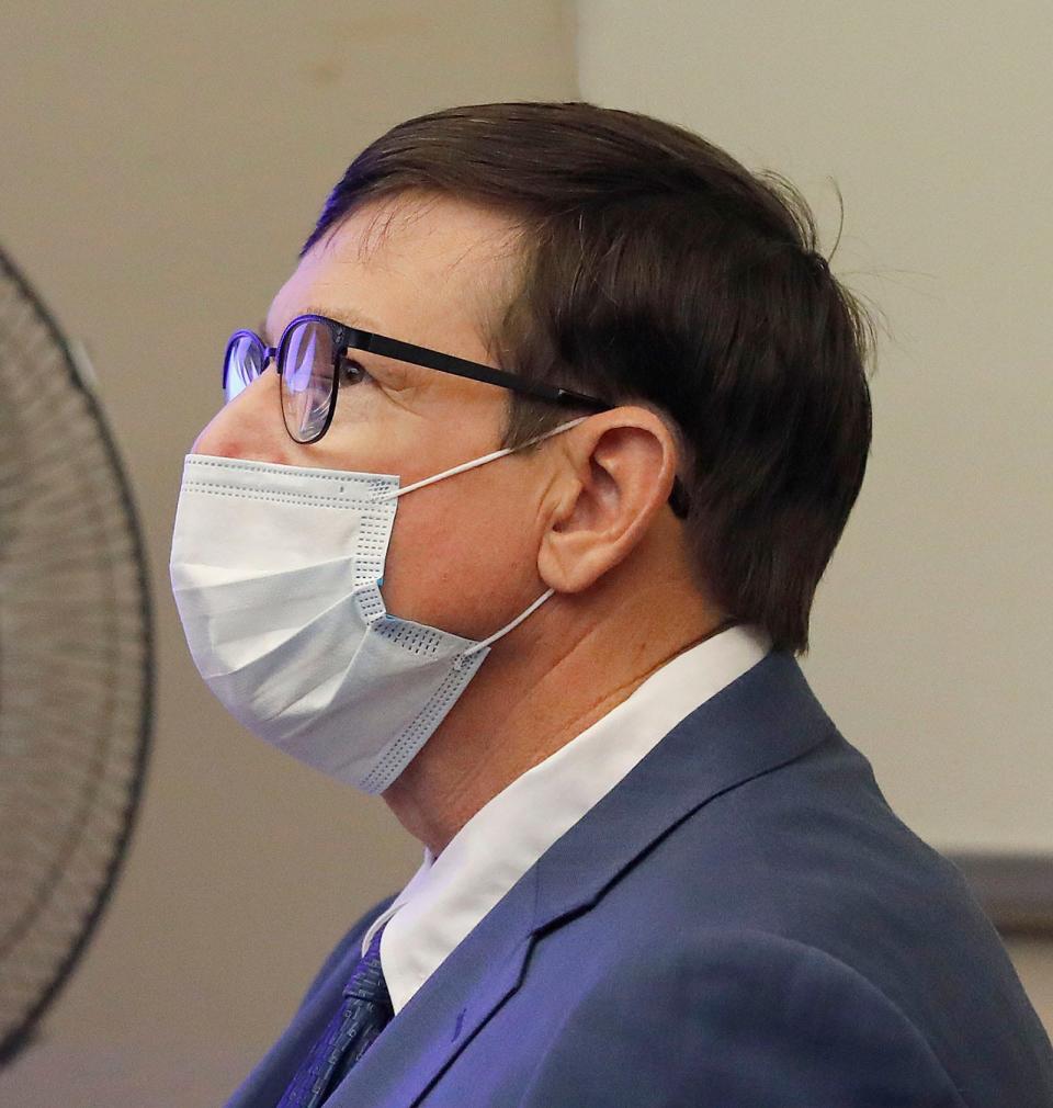 Former Cohasset teacher Jeffrey Knight listens during the first day of his sexual assault trial in Quincy District Court on Monday, Nov. 15, 2021.