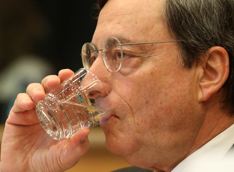 President of the European Central Bank Mario Draghi drinks as he reports to the Economic Committee, in capacity as the head of the European Systemic Risk Board, at the European Parliament in Brussels, Thursday, May 31, 2012. (AP Photo/Yves Logghe)