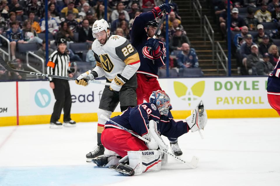 Mar 4, 2024; Columbus, Ohio, USA; Columbus Blue Jackets goaltender Daniil Tarasov (40) saves a shot in front of Vegas Golden Knights right wing Michael Amadio (22) and Columbus Blue Jackets defenseman Erik Gudbranson (44) during the second period of the NHL hockey game at Nationwide Arena.