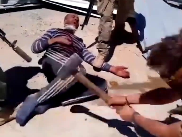 Footage shows beheading of a Syrian prisoner by what appear to be Russian mercenaries in 2017: Screen shot