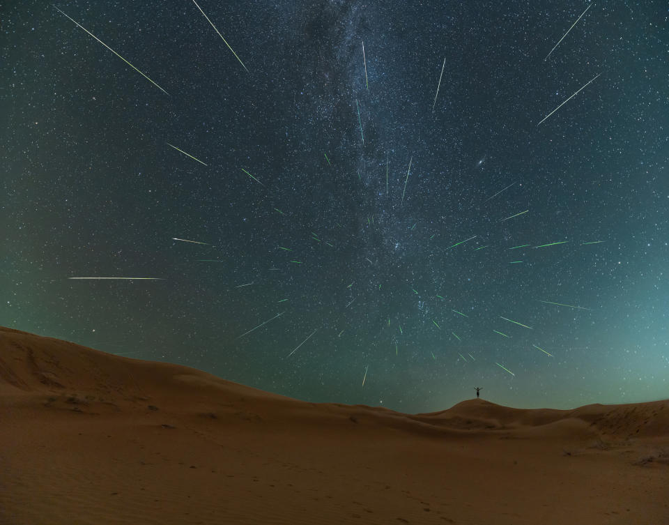 Starry night sky with several white streaks.