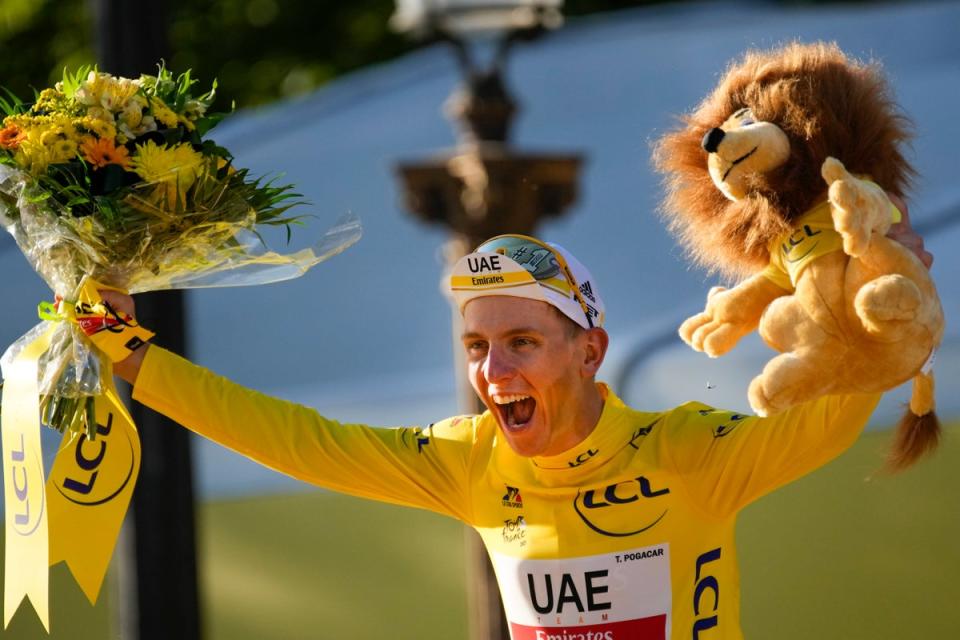 Pogacar celebrates winning the 2021 Tour de France (AP)