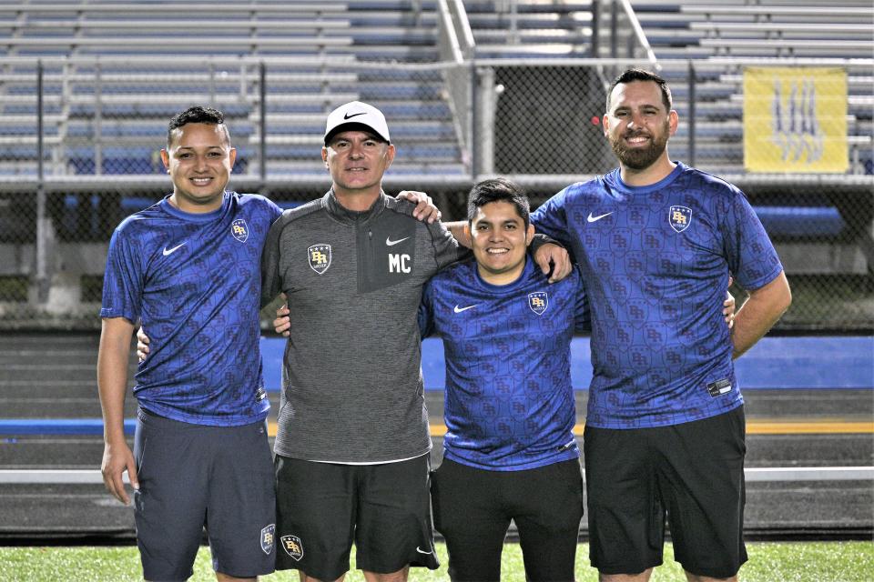 Pictured from left to right are Boca assistant coach Angel Andino, head coach Marcelo Castillo, assistant coach Felipe Astudillo, and Derick Santos, taken following a playoff game against Royal Palm Beach on Feb. 8, 2023.