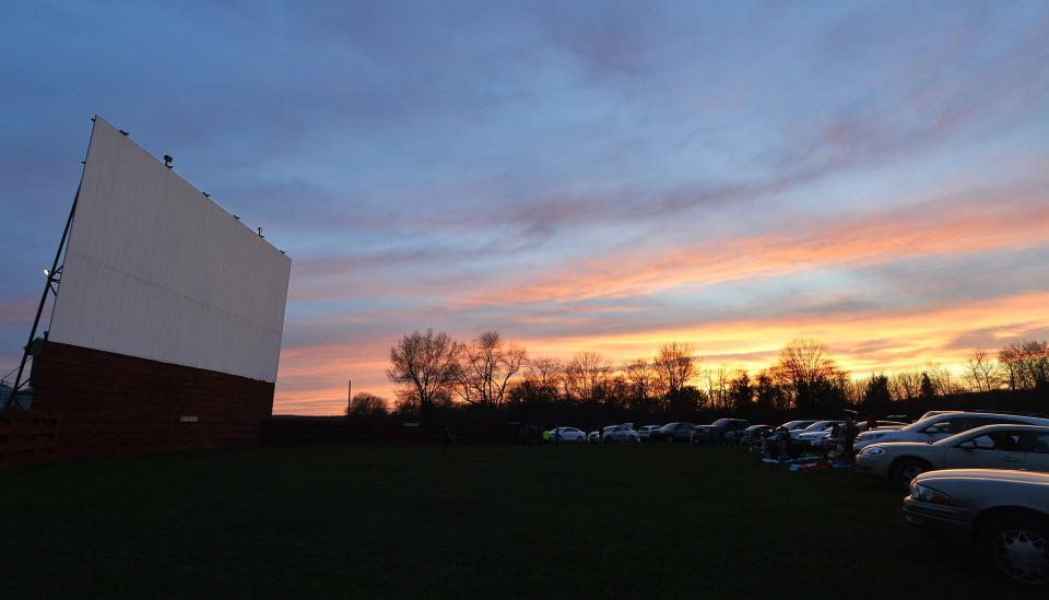 Movie fans wait in their cars for a double-feature to begin at the Sunset Drive In in Waterford Township.