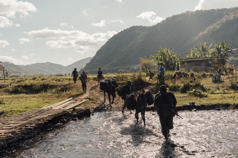 Rangers cross a stream in view of a Burma Army outpost near Limerplaw village. A failed militia attempt to overrun the base in December left five dead and more than 20 injured.