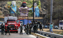 Security forces block the road as they clash with lawmaker members of the Venezuelan National Assembly and supporters of the Venezuelan opposition leader Juan Guaido, who many nations have recognised as the country's rightful interim ruler, on the outskirts of Mariara, Venezuela February 21, 2019. REUTERS/Andres Martinez Casares