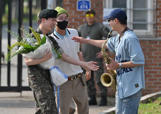 <p>JUNG YEON-JE/AFP via Getty</p> From Left: Jin with J-Hope and RM on June 12, 2024