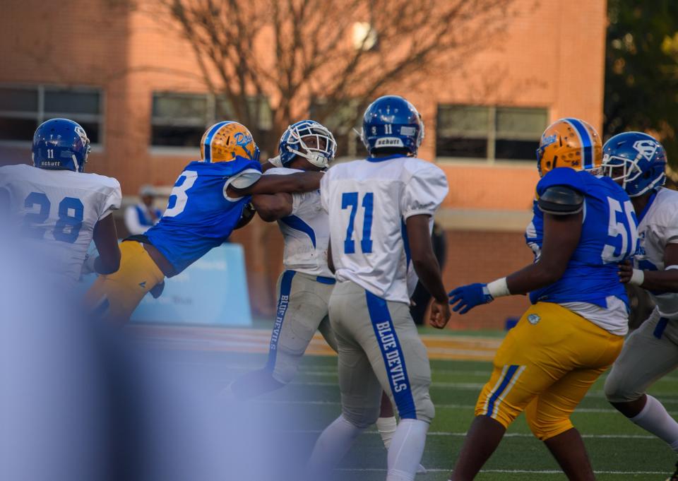 Bay Springs defensive end Cartize Booth (3) sacks Simmons quarterback Devontae Rush (7)during the first quarter of the MHSAA Class 1A football championships in Hattiesburg, Miss., on Friday, Dec. 3, 2021.