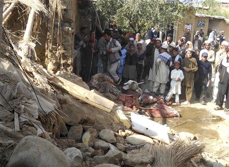 Students gather at the site of a suspected U.S. drone strike on an Islamic seminary in Hangu district, bordering North Waziristan, November 21, 2013. REUTERS/Syed Shah