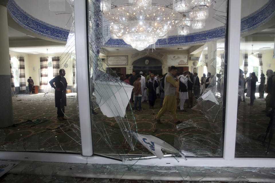 Afghans inspect the inside of a mosque following a bombing, in Kabul, Afghanistan, Friday, June 12, 2020. (AP Photo/Rahmat Gul)