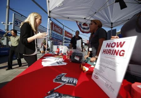 People browse booths at a military veterans' job fair in Carson, California October 3, 2014. REUTERS/Lucy Nicholson