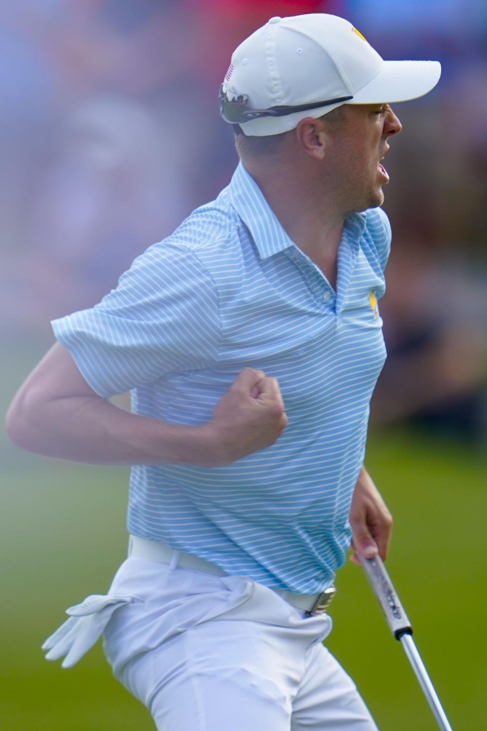 Justin Thomas hits a birdie putt on the 15th green during their foursomes match at the Presidents Cup golf tournament at the Quail Hollow Club, Thursday, Sept. 22, 2022, in Charlotte, N.C. (AP Photo/Julio Cortez)