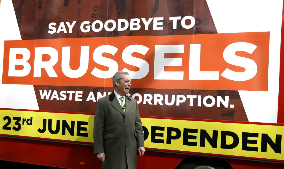 FILE- In this Thursday, March 31, 2016 file photo, Nigel Farage, leader of Britain's UKIP party walks past a 'Grassroots Out' advertising lorry outside the Electoral Commission, in London. Five years ago, Britons voted in a referendum that was meant to bring certainty to the U.K.’s fraught relationship with its European neigbors. Voters’ decision on June 23, 2016 was narrow but clear: By 52 percent to 48 percent, they chose to leave the European Union. It took over four years to actually make the break. The former partners are still bickering, like many divorced couples, over money and trust.(AP Photo/Kirsty Wigglesworth, File)