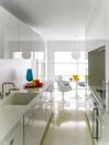 <p>In a <a href="https://www.elledecor.com/design-decorate/house-interiors/a8970/minimalist-decor/" rel="nofollow noopener" target="_blank" data-ylk="slk:playful NYC apartment;elm:context_link;itc:0;sec:content-canvas" class="link ">playful NYC apartment</a>, the kitchen cabinetry is by Bulthaup, the countertop and sink are Corian, the fittings are by Vola, and the oven and cooktop are by Gaggenau; the light fixture is by Bega, and the floor is terrazzo.</p>