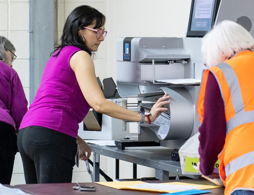 Deputy Director of City of Milwaukee Election Commission Paulina Gutierrez fixes a jammed tabulator containing ballots for the 2023 Wisconsin spring general election on Tuesday April 4, 2023 at Central Count in Milwaukee.