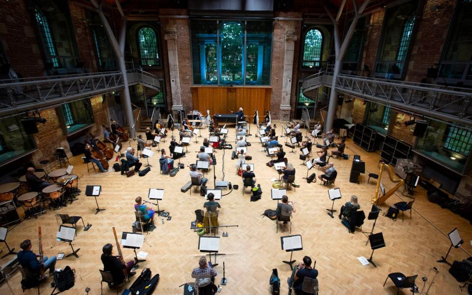 A socially distanced rehearsal with Sir Simon Rattle and the London Symphony Orchestra  - PA