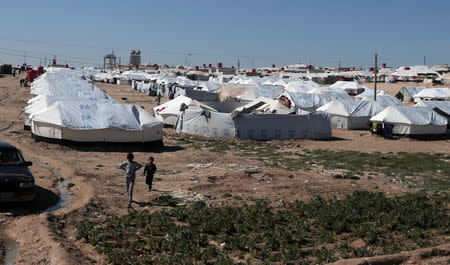 Boys walk at al-Hol displacement camp in Hasaka governorate, Syria March 8, 2019. REUTERS/Issam Abdallah