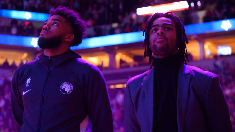 MINNEAPOLIS, MN - FEBRUARY 8: Minnesota Timberwolves center Karl-Anthony Towns (32) stood beside guard D'Angelo Russell (0) for the national anthem before an NBA game against the LA Clippers at Target Center on Saturday, Feb.