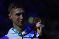 Florian Wellbrock of Germany celebrates a third place after the men's 1500m freestyle final at the 19th FINA World Championships in Budapest, Hungary, Saturday, June 25, 2022. (AP Photo/Petr David Josek)